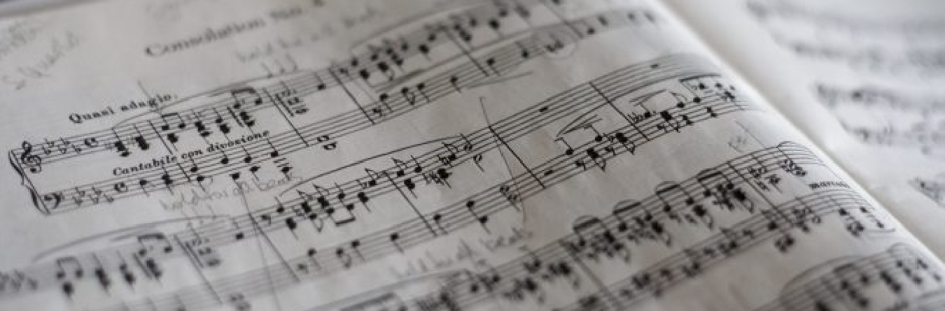 sheet music with handwritten notes in the corner